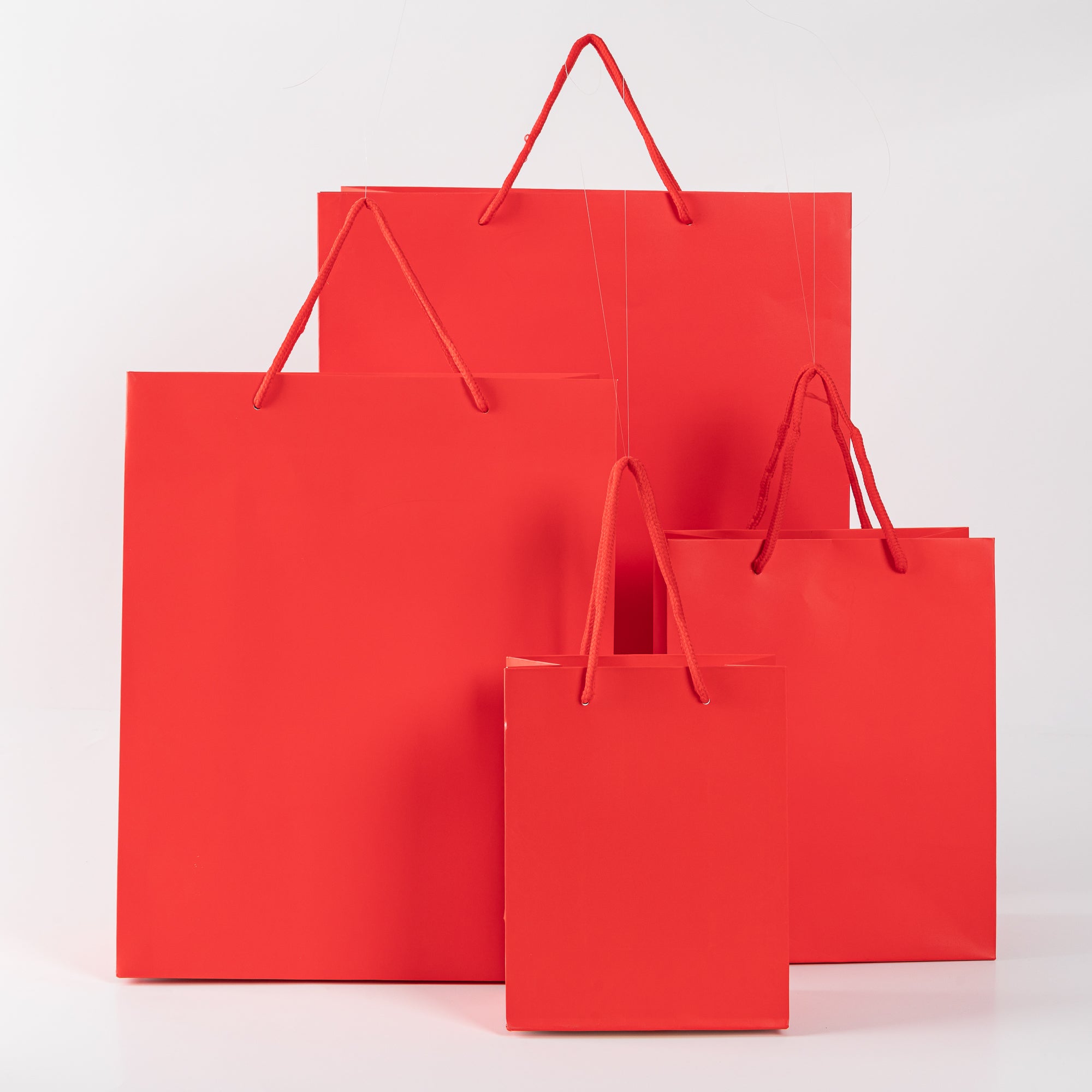 12x Papieren koordtas - 18cm x 14cm x 8cm - Rood