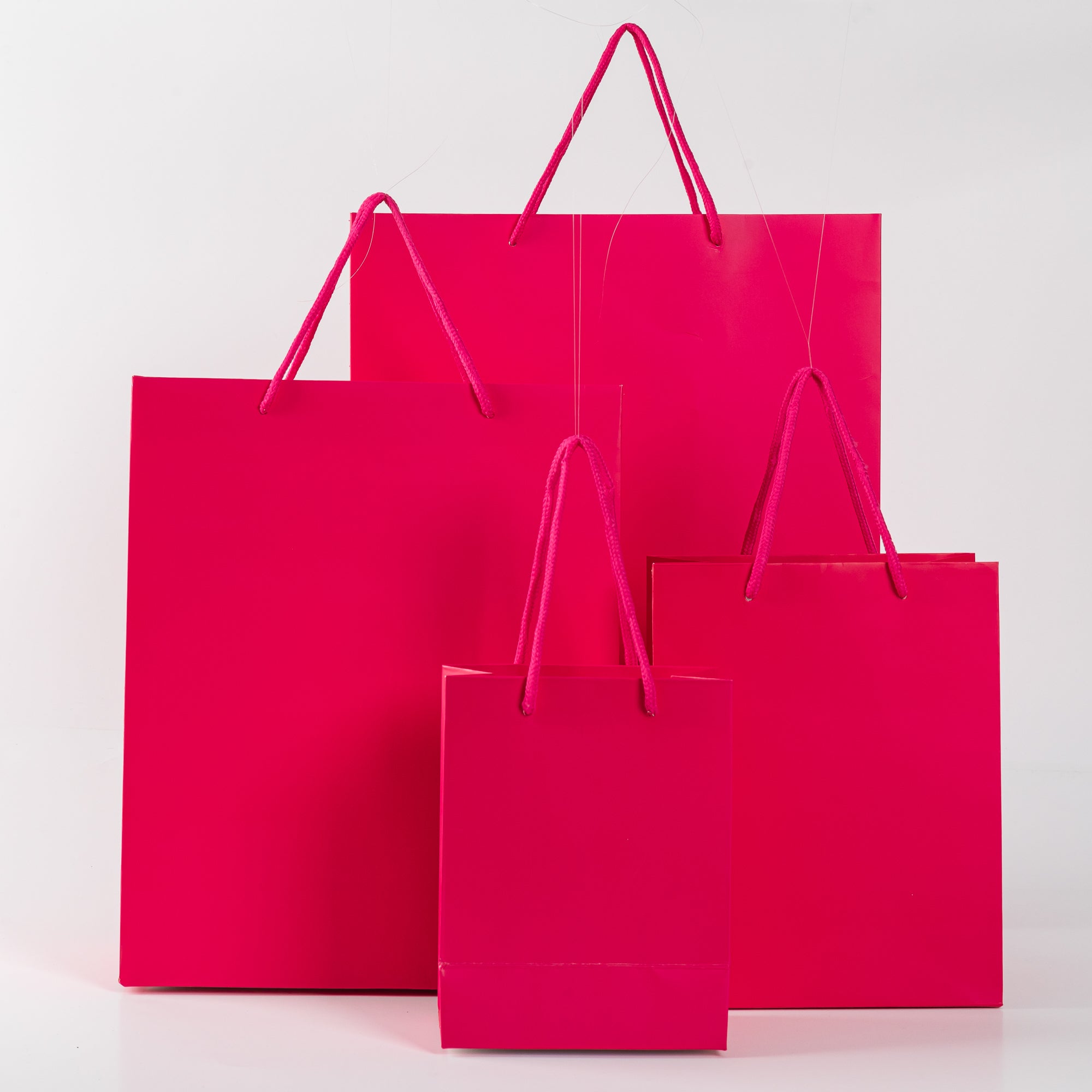 12x Paper drawstring bag - 18cm x 14cm x 8cm - Hot Pink 