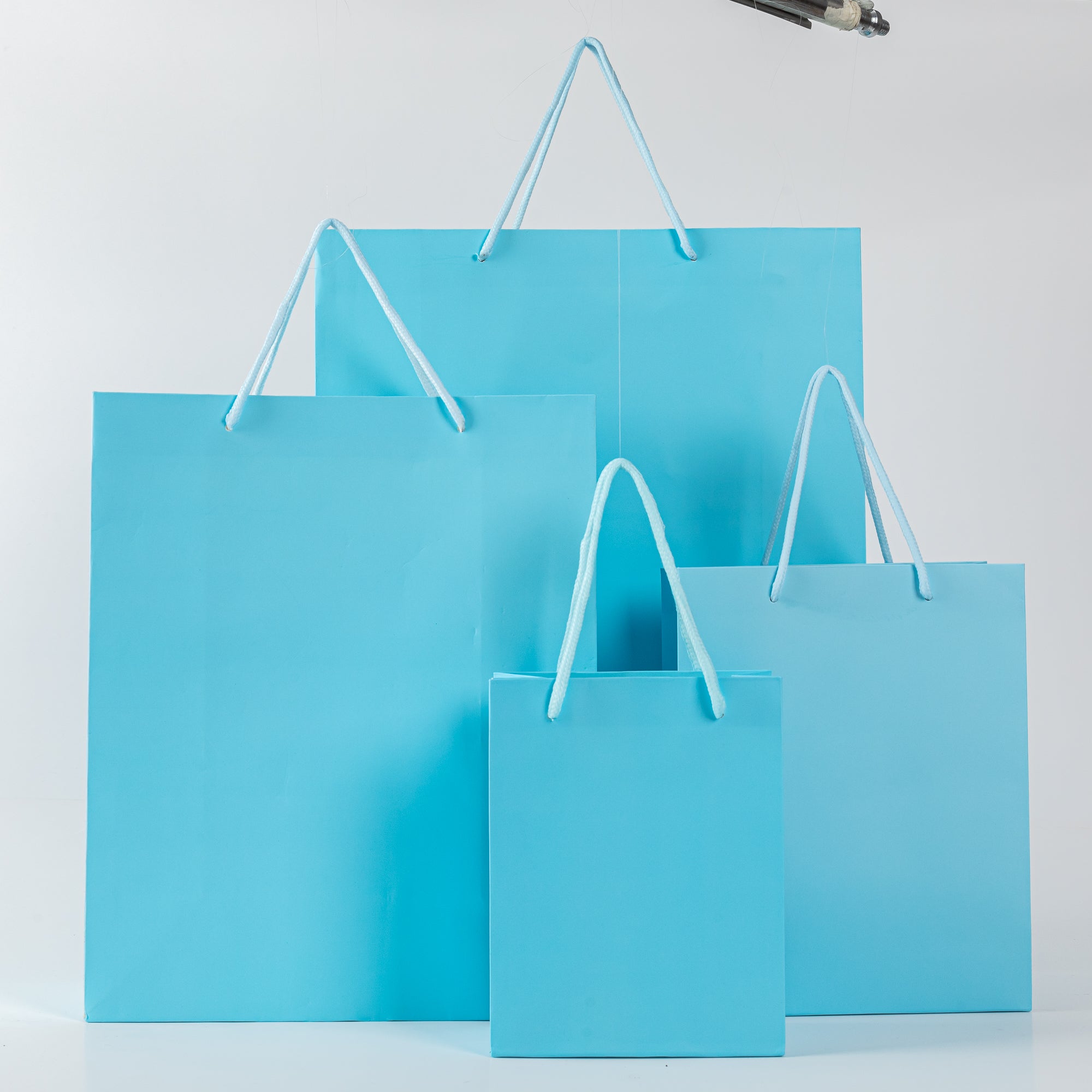 12x Papieren koordtas - 18cm x 23cm x 10cm - Blauw